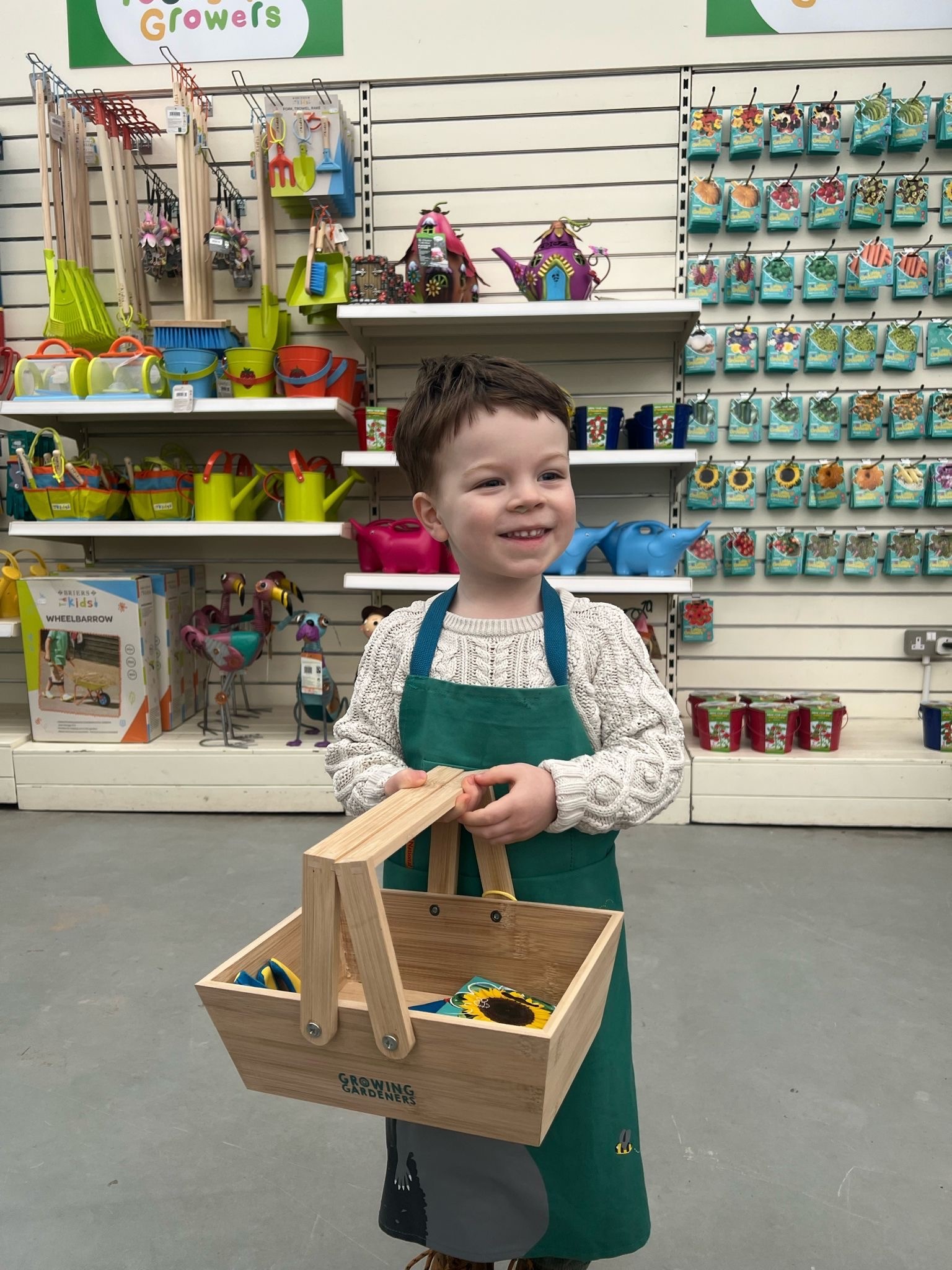 Photograph of child using the Young Growers gardening tools